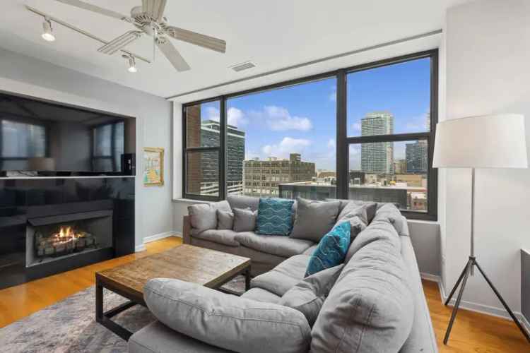 River North 3-Bed 2-Bath Corner Unit with City Views and Amenities