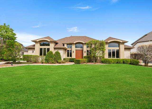 Luxury 5-Bedroom Ranch Home with Gourmet Kitchen and Smart Home Features